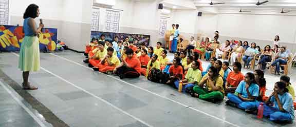 Students-and-parents-listening-intently-to-Ms-Ishita-Manek
